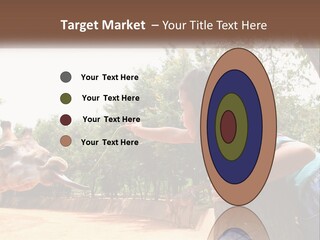 Girl Feeding A Giraffe PowerPoint Template