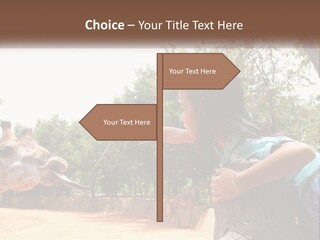 Girl Feeding A Giraffe PowerPoint Template