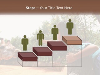 Girl Feeding A Giraffe PowerPoint Template