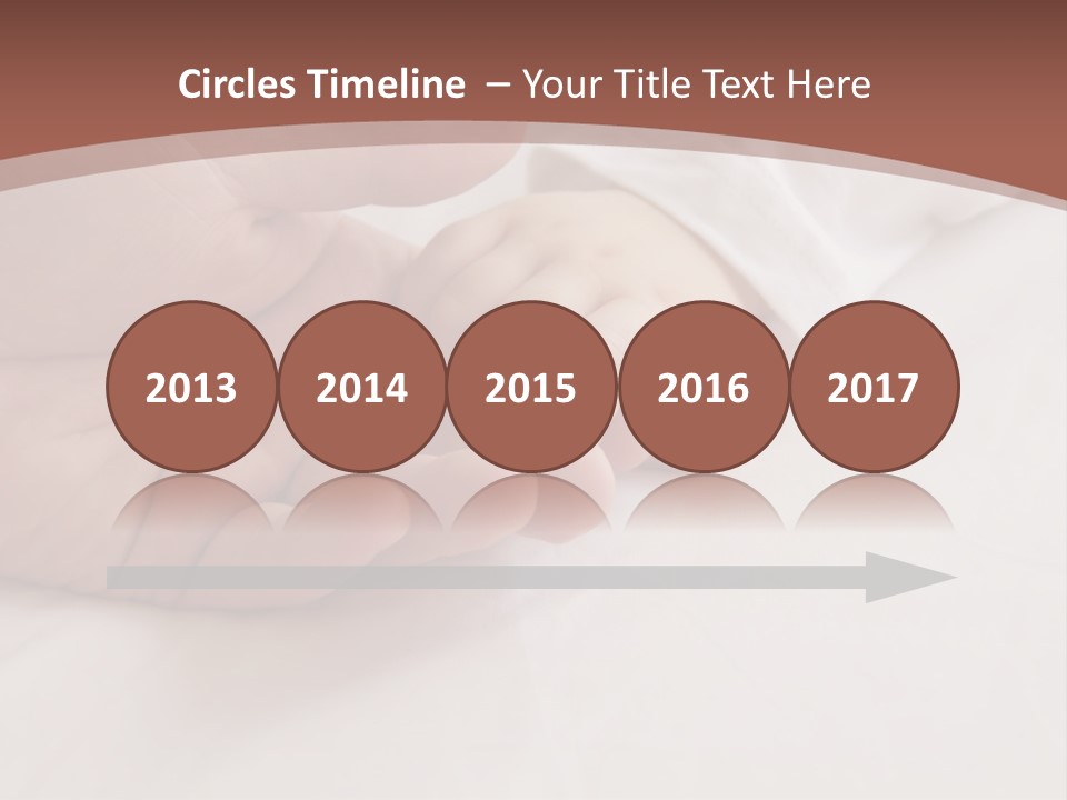 Baby Holding Dad's Finger PowerPoint Template