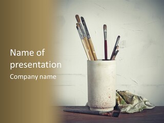 Glass With Artist's Brushes PowerPoint Template