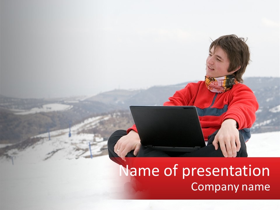 Man With Laptop On Snowy Hills PowerPoint Template