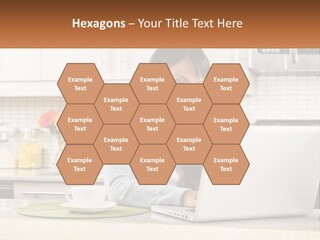 Girl At The Laptop In The Kitchen PowerPoint Template