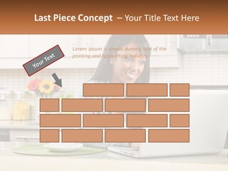 Girl At The Laptop In The Kitchen PowerPoint Template
