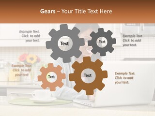 Girl At The Laptop In The Kitchen PowerPoint Template