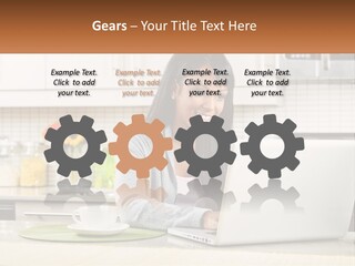 Girl At The Laptop In The Kitchen PowerPoint Template