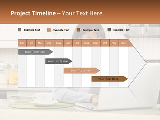 Girl At The Laptop In The Kitchen PowerPoint Template
