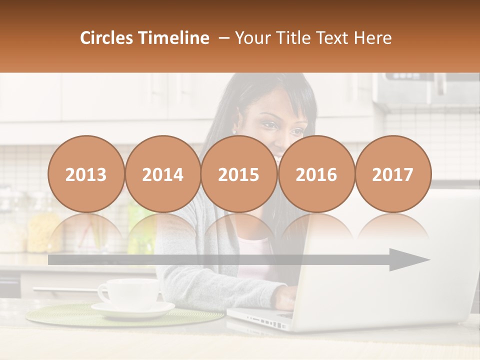 Girl At The Laptop In The Kitchen PowerPoint Template