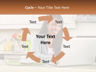 Girl At The Laptop In The Kitchen PowerPoint Template