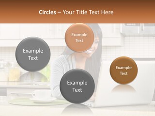 Girl At The Laptop In The Kitchen PowerPoint Template