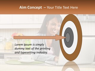 Girl At The Laptop In The Kitchen PowerPoint Template