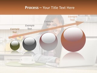 Girl At The Laptop In The Kitchen PowerPoint Template
