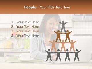 Girl At The Laptop In The Kitchen PowerPoint Template