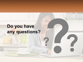 Girl At The Laptop In The Kitchen PowerPoint Template