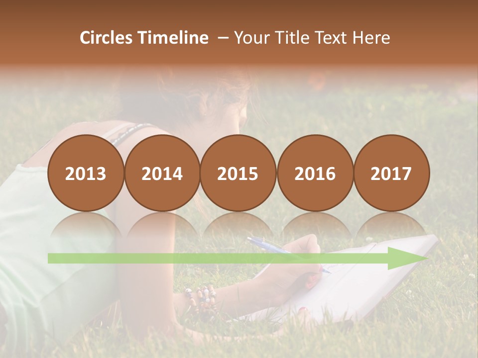 The Girl Is Lying On The Grass And Writing Something PowerPoint Template