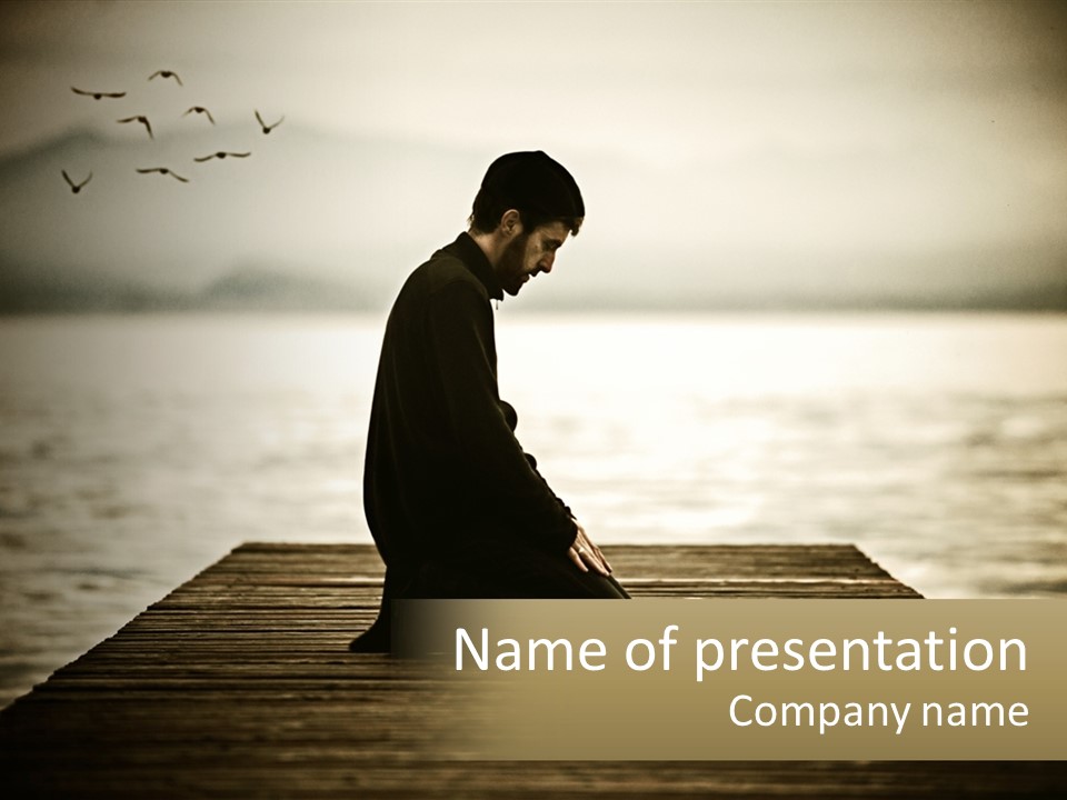 Man Kneeling By The Sea PowerPoint Template