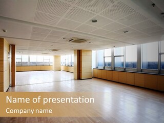 A Large Empty Room With A Lot Of Windows PowerPoint Template