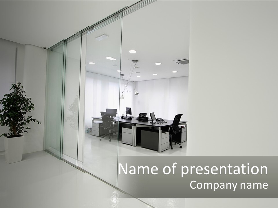 An Office With Glass Walls And A Plant In The Middle PowerPoint Template