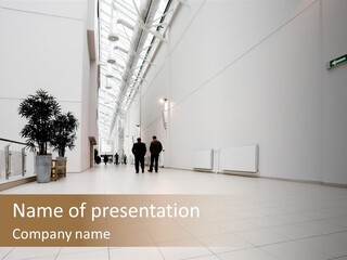 A Couple Of People Walking Down A Hallway PowerPoint Template