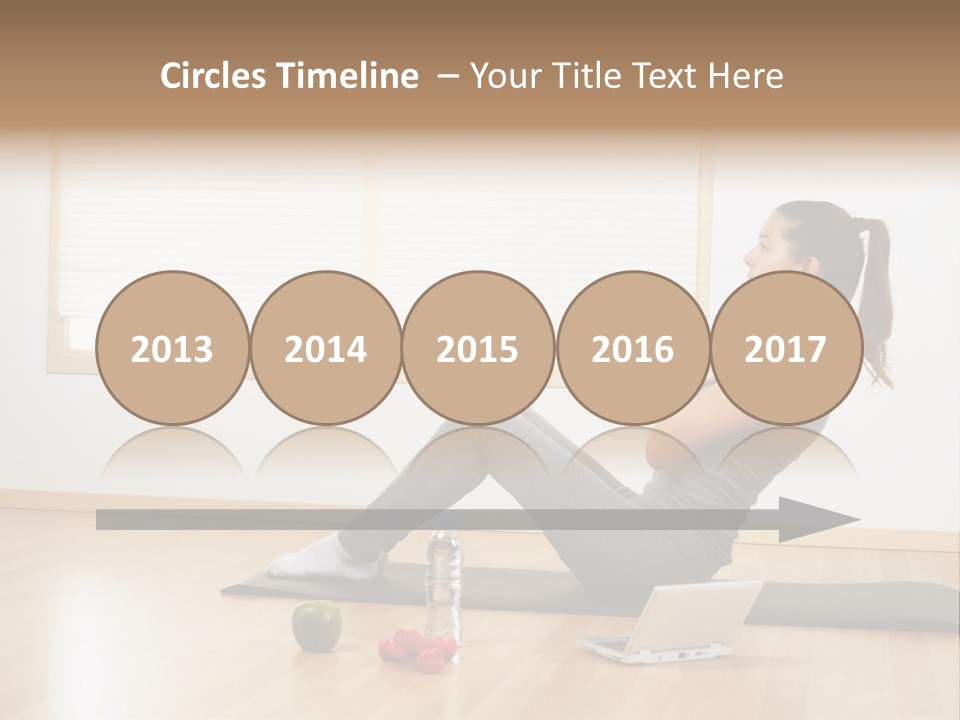 A Woman Sitting On The Floor Using A Laptop Computer PowerPoint Template