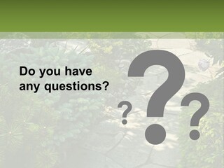 A Garden With Lots Of Plants And Rocks PowerPoint Template