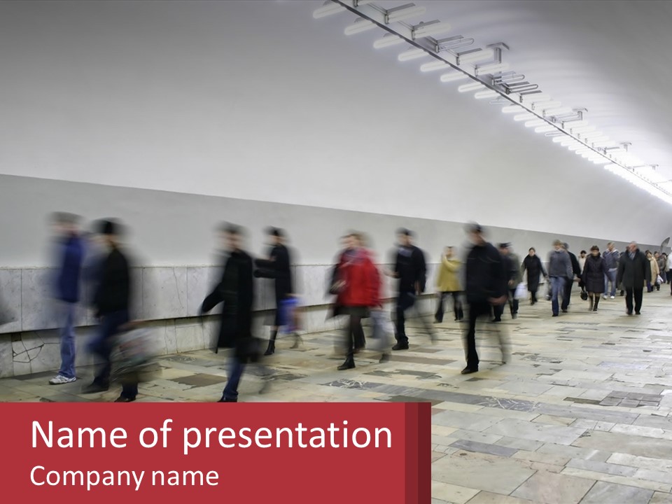A Group Of People Walking Down A Long Hallway PowerPoint Template