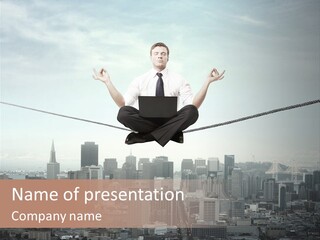 A Man Sitting On A Rope With A Laptop In His Hands PowerPoint Template