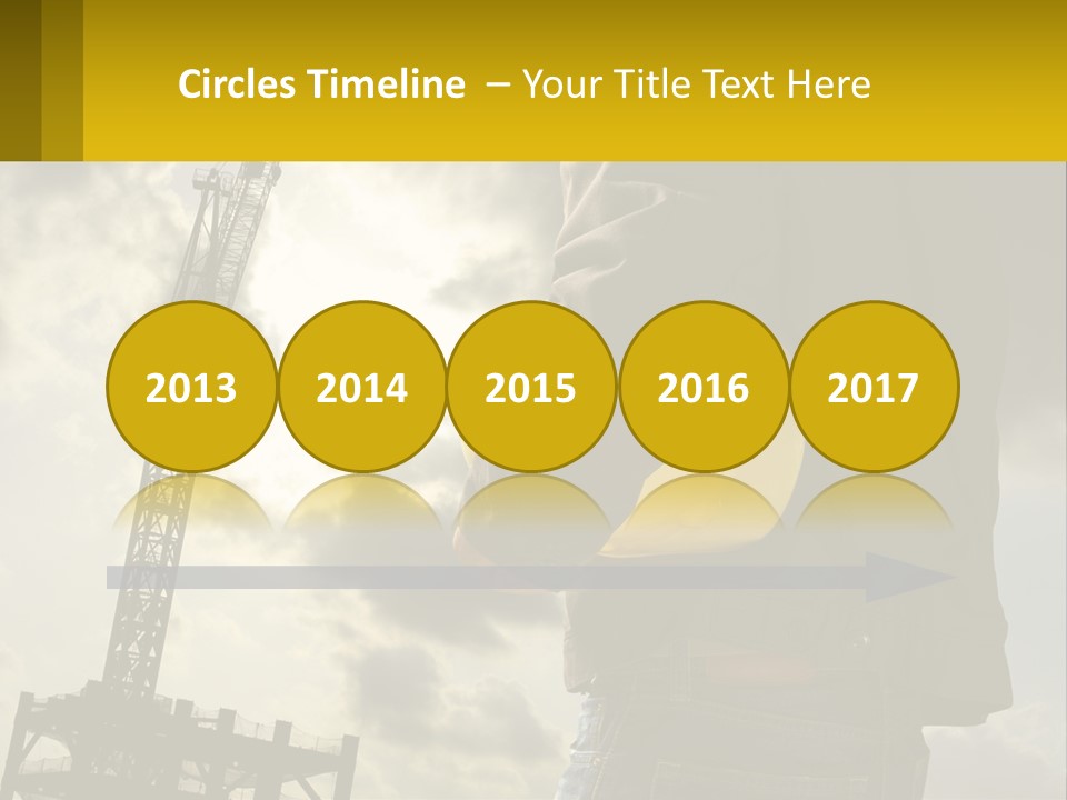 A Man Holding A Yellow Safety Helmet In Front Of A Crane PowerPoint Template