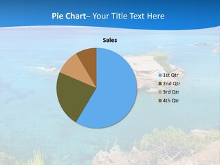 A Beautiful Blue Ocean With A Sandy Beach In The Foreground PowerPoint Template