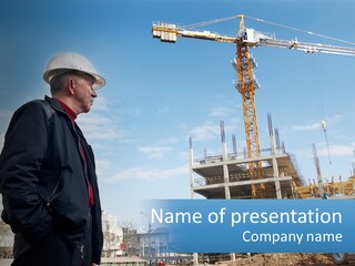 A Man Standing In Front Of A Construction Site PowerPoint Template