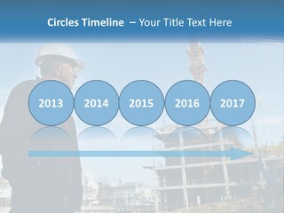 A Man Standing In Front Of A Construction Site PowerPoint Template