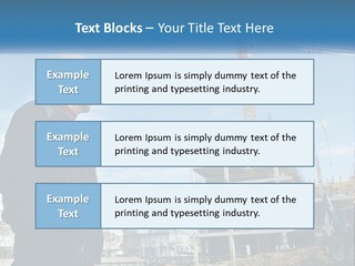 A Man Standing In Front Of A Construction Site PowerPoint Template