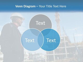 A Man Standing In Front Of A Construction Site PowerPoint Template