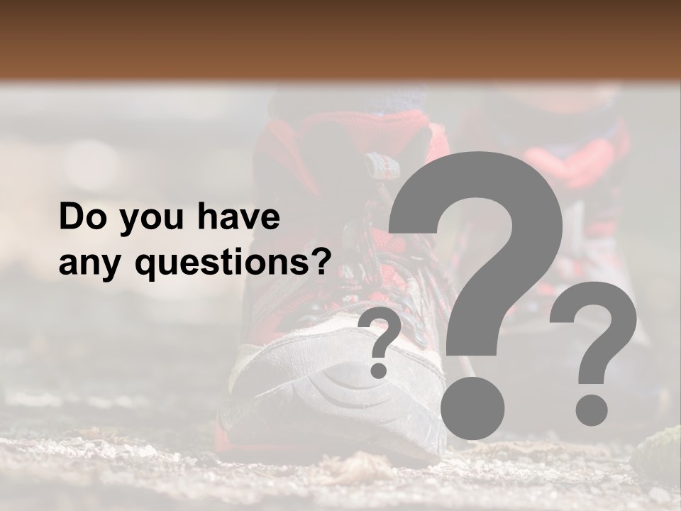 A Person's Feet In Hiking Shoes On The Ground PowerPoint Template