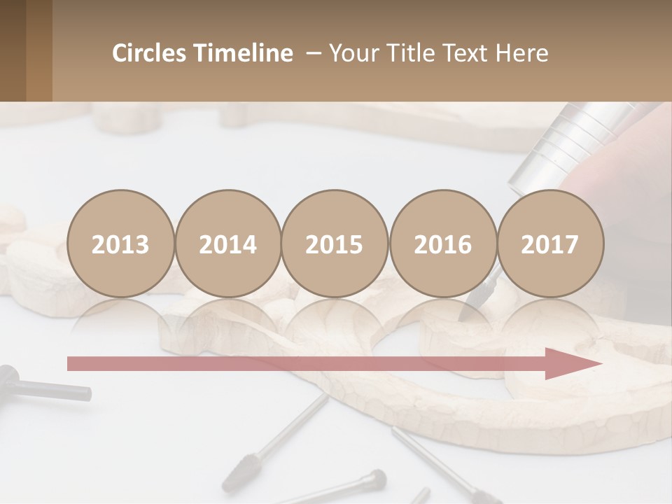 A Person Is Carving A Piece Of Wood With A Drill PowerPoint Template