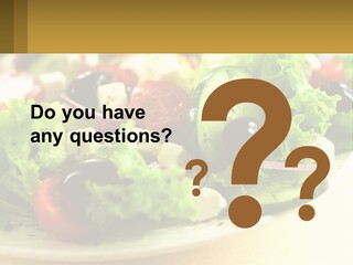 A Salad With Cucumbers And Olives On A Plate PowerPoint Template