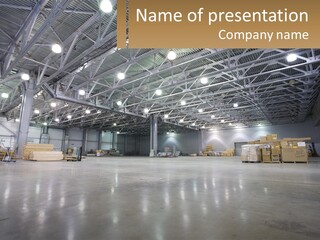 A Large Warehouse With Lots Of Boxes And Lights PowerPoint Template