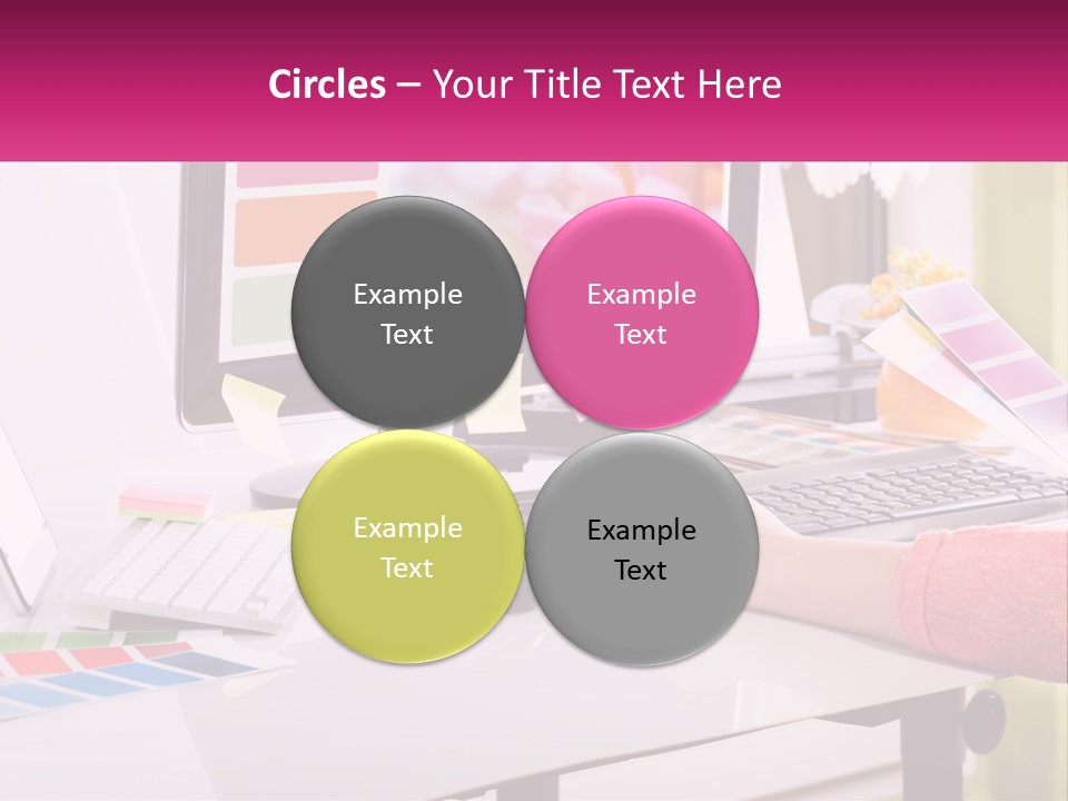 A Woman Sitting At A Desk Using A Computer PowerPoint Template