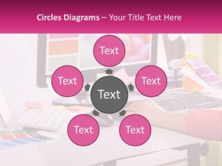 A Woman Sitting At A Desk Using A Computer PowerPoint Template