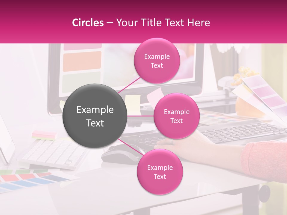 A Woman Sitting At A Desk Using A Computer PowerPoint Template