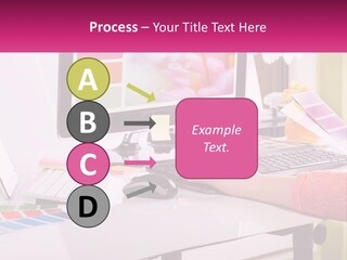 A Woman Sitting At A Desk Using A Computer PowerPoint Template