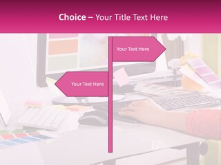 A Woman Sitting At A Desk Using A Computer PowerPoint Template