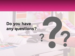 A Woman Sitting At A Desk Using A Computer PowerPoint Template