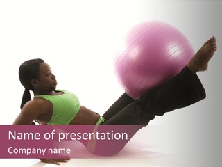 A Woman In A Green Shirt Is Doing A Yoga Pose With A Pink Ball PowerPoint Template