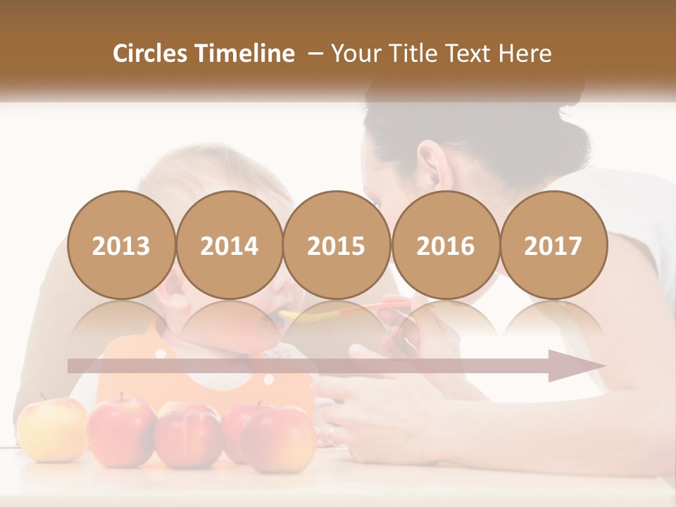 A Woman Feeding A Baby With A Spoon PowerPoint Template