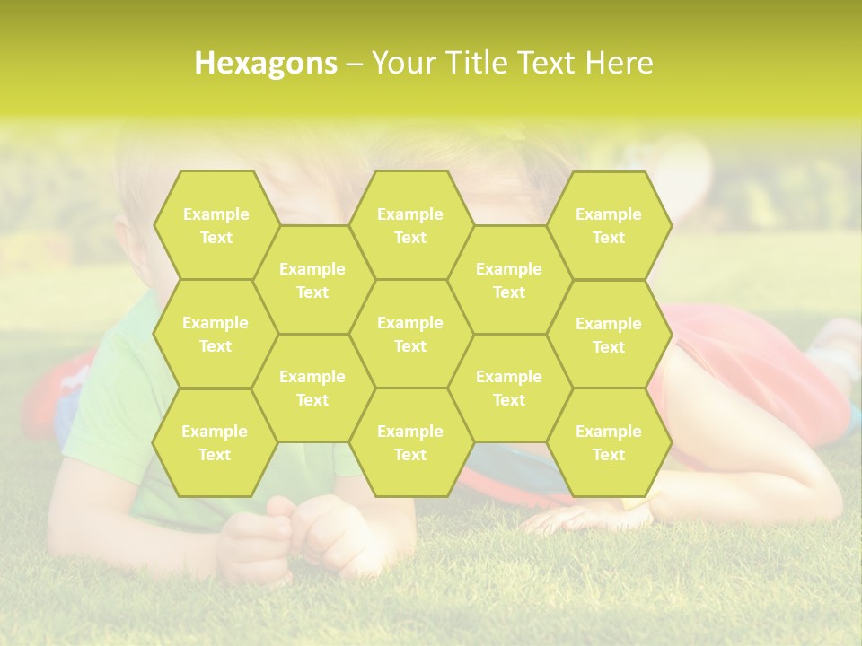 Two Young Children Laying On The Grass In A Park PowerPoint Template