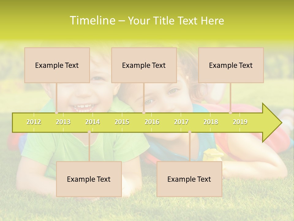 Two Young Children Laying On The Grass In A Park PowerPoint Template