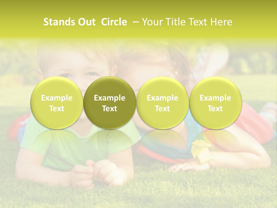 Two Young Children Laying On The Grass In A Park PowerPoint Template