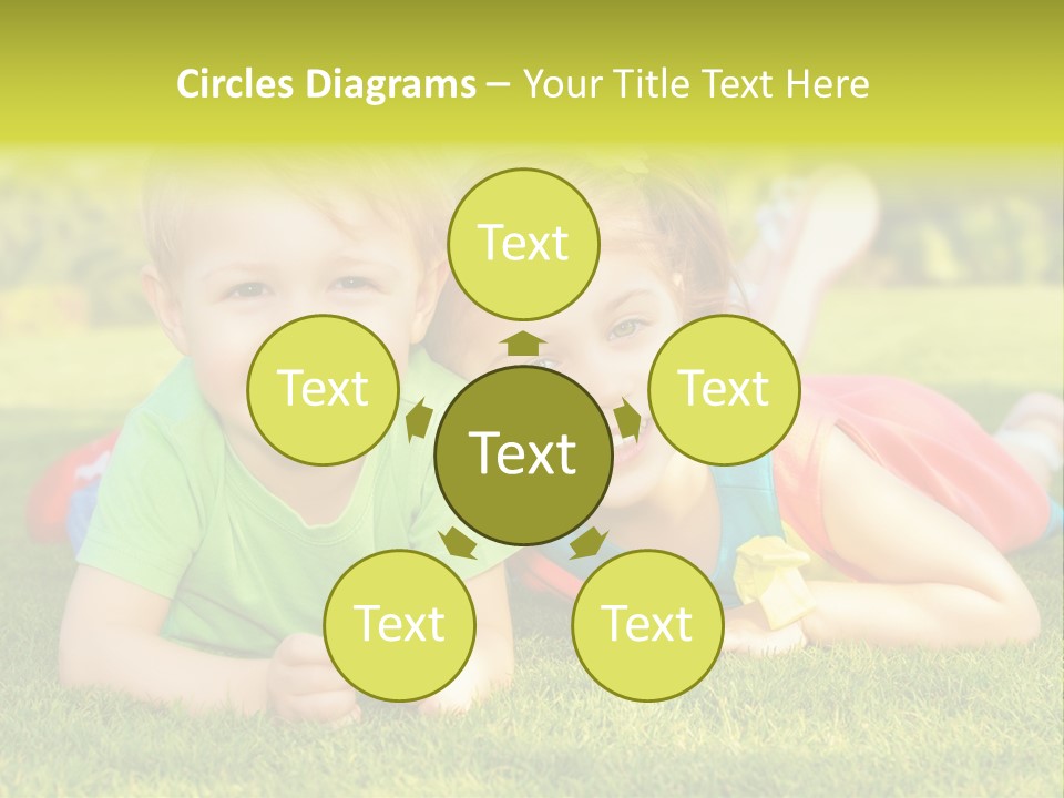 Two Young Children Laying On The Grass In A Park PowerPoint Template