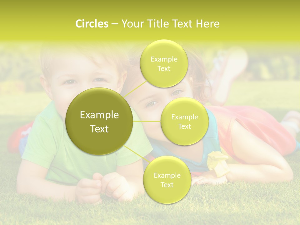 Two Young Children Laying On The Grass In A Park PowerPoint Template